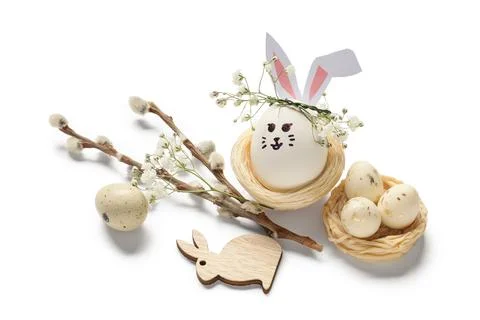 Nests of cute painted Easter eggs with drawn face, pussy willow branches and  Stock Photos