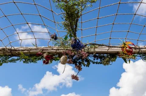 Net with artificial flowers Stock Photos