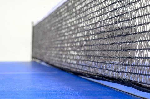 Net on a blue pingpong table close-up Foto stock