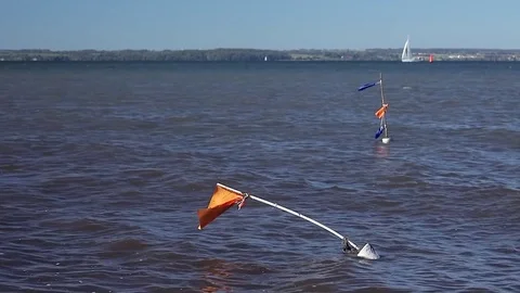 Net buoys on shallow beach Stock Footage