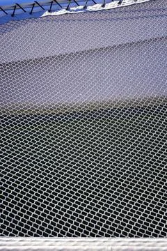 Net on a catamaran. Stock Photos