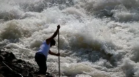 Net fishing in fast river Stock Footage 10746606