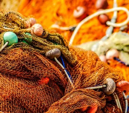 A net with many beads and strings on it Stock Photos