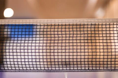 The net of the ping pong table. The net is placed in the center of the table, Stock Photos