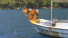 Net Reel on Small Fishing Boat Pulling N, Stock Video