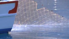 Net Reel on Small Fishing Boat Pulling N, Stock Video