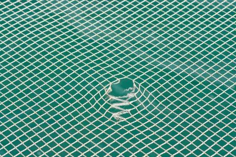 The net is torn, ready to be repaired. Stock Photos