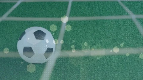 Net vibration causing soccer ball rolling and rotating on turf, hex bokeh Stock Footage 333602731