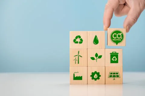 Net zero and carbon neutral concept. Put wooden cubes with green net zero ico Stock Photos