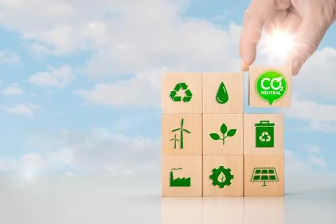 Net zero and carbon neutral concept. Put wooden cubes with green net zero ico Stock Photos