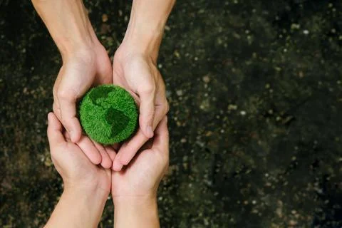 Net Zero and Carbon Neutral Concepts.Close up hands holding the earth to pr.. Stock Photos