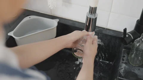 Net zero go green waste rinse clean dry empty bottles before recycling Stock Footage 248411543