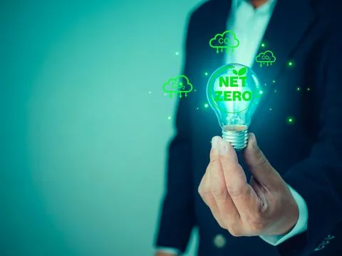 Net zero symbol with Co2 cloud icons around lightbulb, Future sustainable i.. Stock Photos