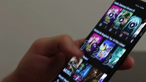 Netflix app. Man using Netflix application on mobil phone Stock Footage 144769543
