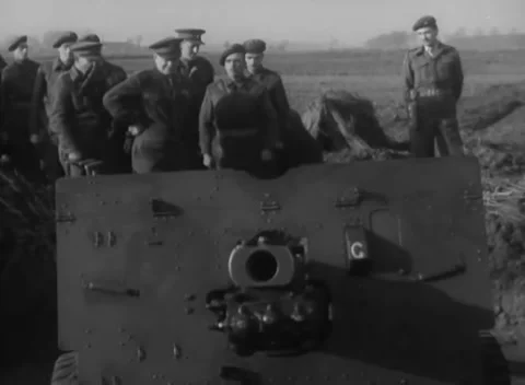NETHERLANDS - 1944: Gun visit — Commanders inspect shells at artillery pit Stock Footage 348533367
