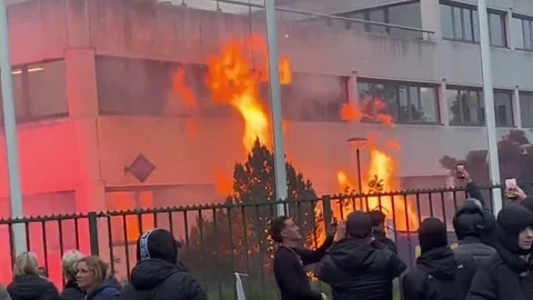 Netherlands: Fire breaks out during anti-migrant protest at asylum center... Stock Footage 334907492