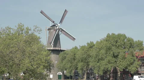 Netherlands windmill through trees Stock Footage 24829890