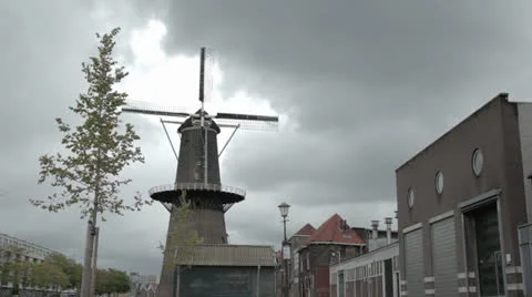 Netherlands windmill with tree in foreground Stock Footage 24830094