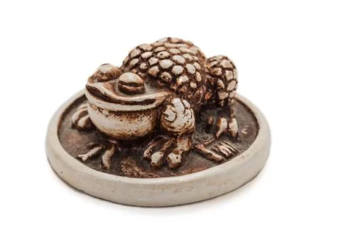 Netsuke toad on a gold coin 库存照片