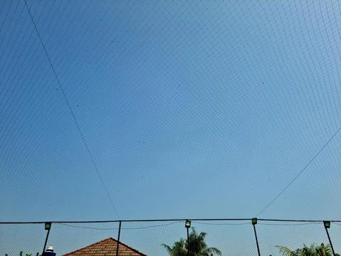 Netting pattern stretched with blue sky background Stock Photos