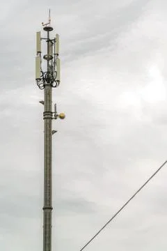 Network antenna on a gray cloudy day Stock Photos