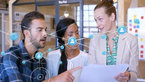 Network appearing over team of three, turning and reviewing documents, Stock Footage 331872430