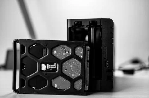 Network attached storage NAS with a single bay pulled setup at a home office and Stock Photos