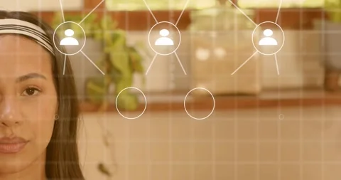 Network build initiating from node and expanding around woman in kitchen Video stock 316890524