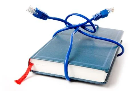 Network cable and book Stock Photos