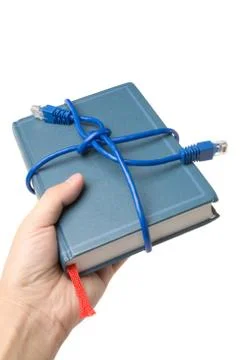 Network cable and book Stock Photos