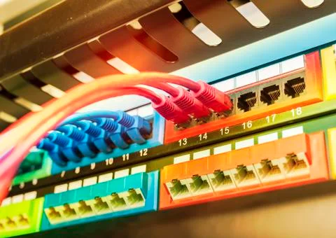 Network cable connecting on network core switch close up Stock Photos