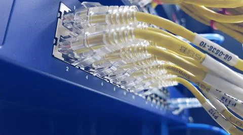 Network cable connecting on network core switch close up Stock Photos