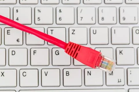 Network cable to keyboard Stock Photos