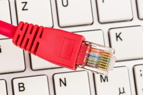 Network cable on keyboard Stock Photos