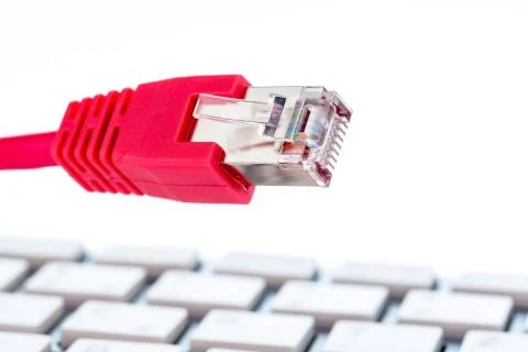 Network cable on keyboard Stock Photos