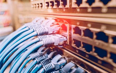 Network cable panel, switch in data center Stock Photos