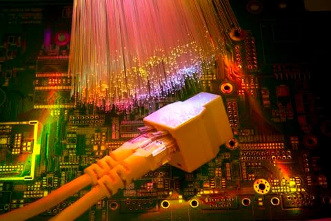 Network cables and hub closeup with fiber optical background Stock Photos
