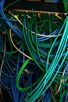 Network Cables and Patch Panel in Server Rack Stock-Fotos