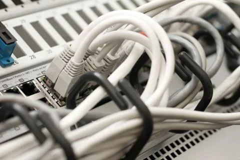 Network cables and servers in a technology data center Stock Photos