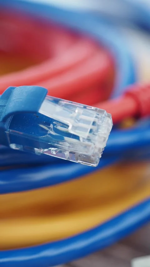Network cables close up in a tech workspace setup Stock Footage 314029892