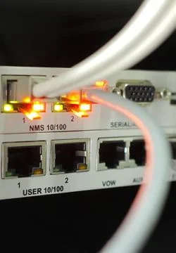 Network cables connected to hub Stock Photos