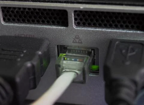 Network cables connected in network switches Stock Photos