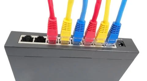 Network cables connected to router Stock Photos