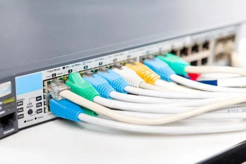 Network cables connected into router Stock Photos