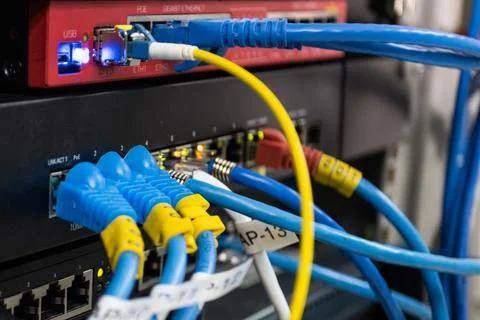 Network cables connected to server switch,  Concept IT infrastructure and m.. Stock Photos