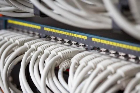 Network cables connected in switch Stock Photos