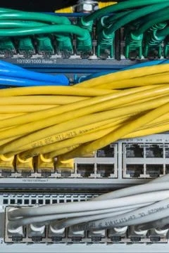 Network cables connected to switch Stock Photos
