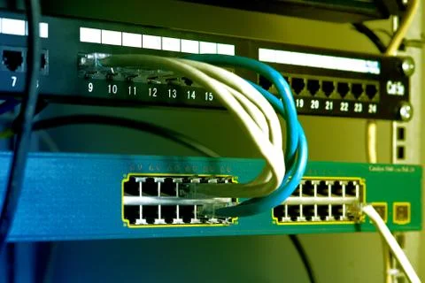 Network cables connected to a switch Stock Photos