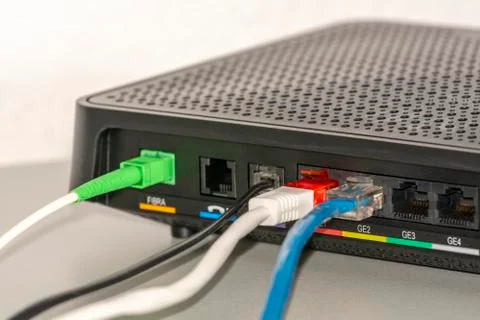 Network cables connected to switch Stock Photos