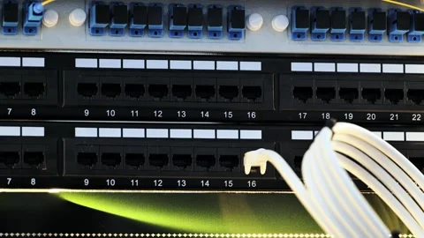 Network cables connecting to patch panel in data center for internet Vídeos de archivo 320520744